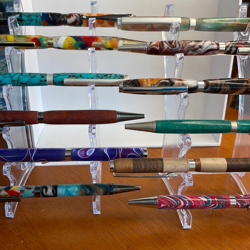 Hand turned acrylic and wood pens.